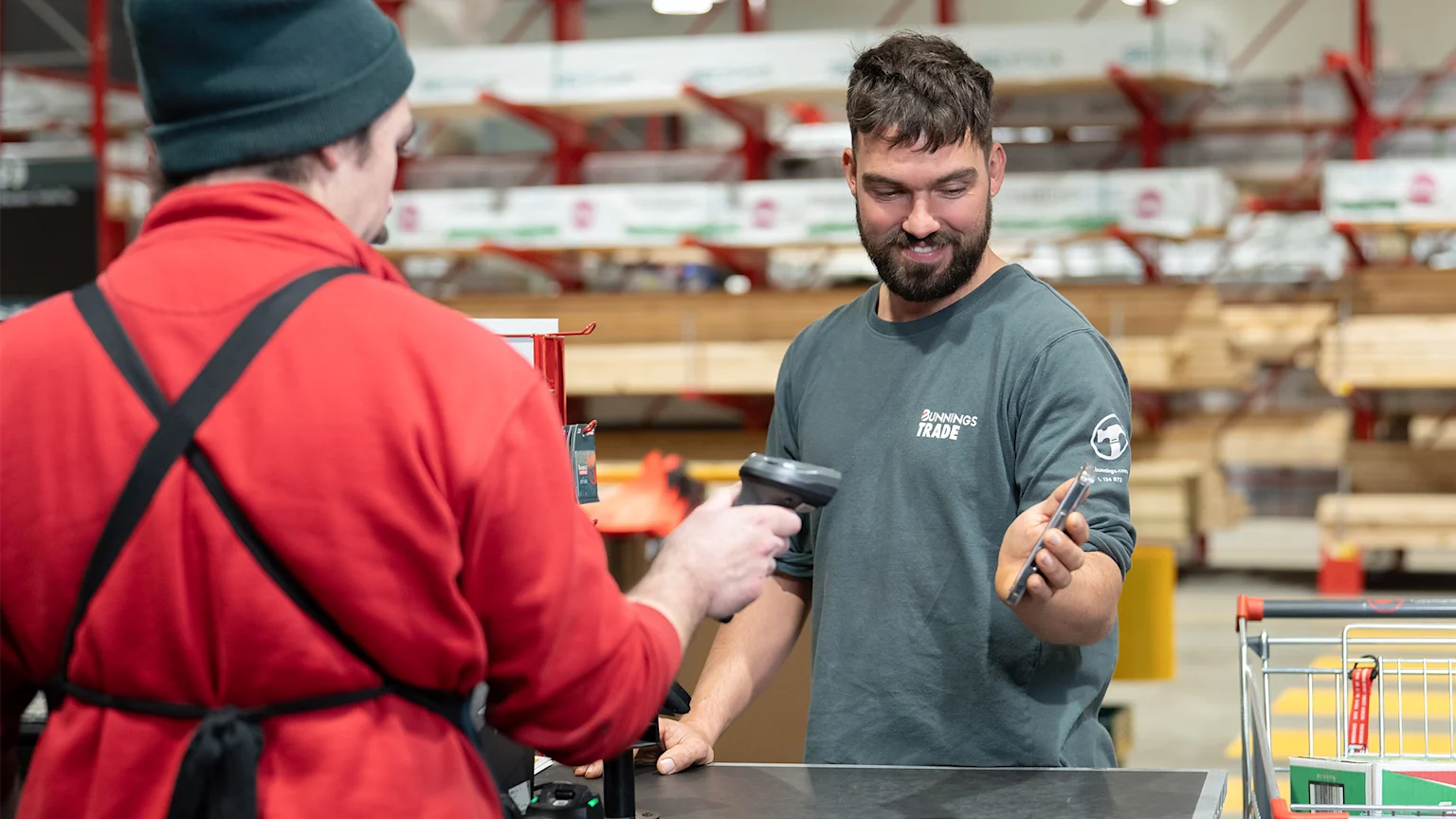 Customer scanning phone at Bunnings Trade checkout