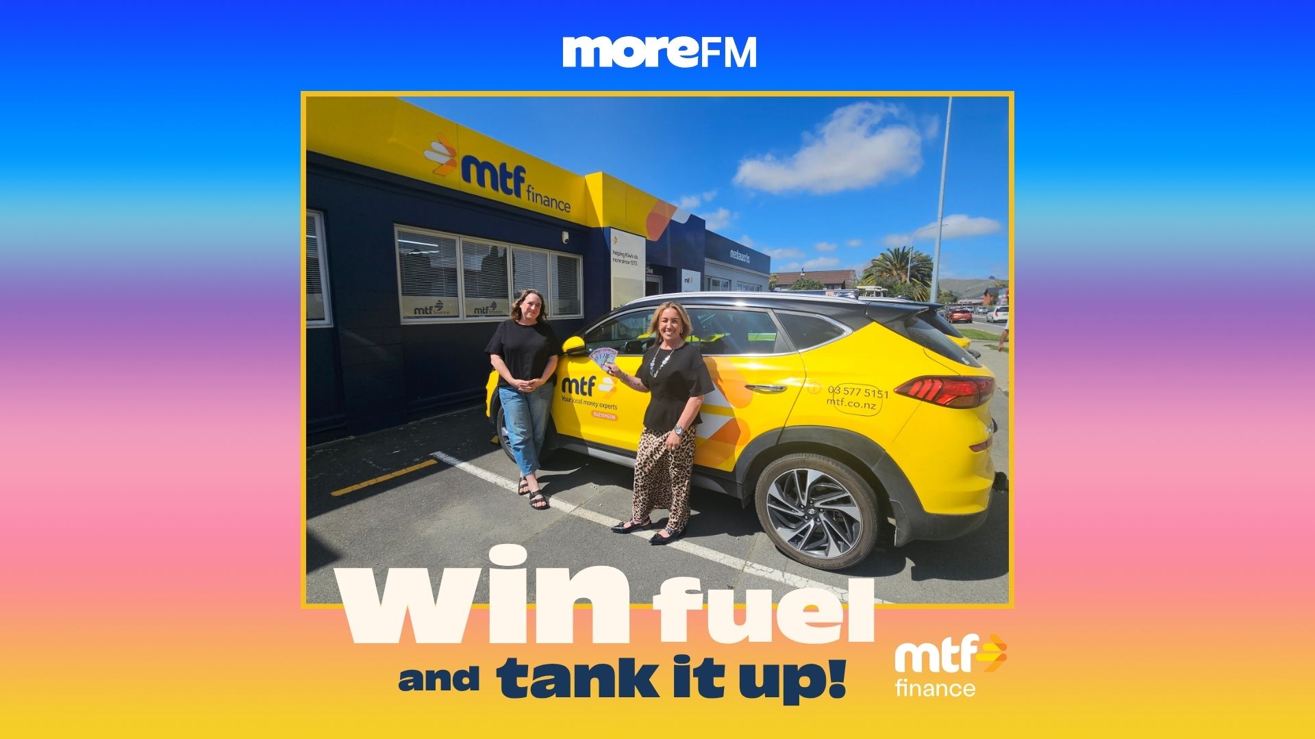 Two women stand in front of an MTF Finance building and a yellow MTF branded car, with "WIN fuel and tank it up!" text, one holding New Zealand currency, advertising a promotion.