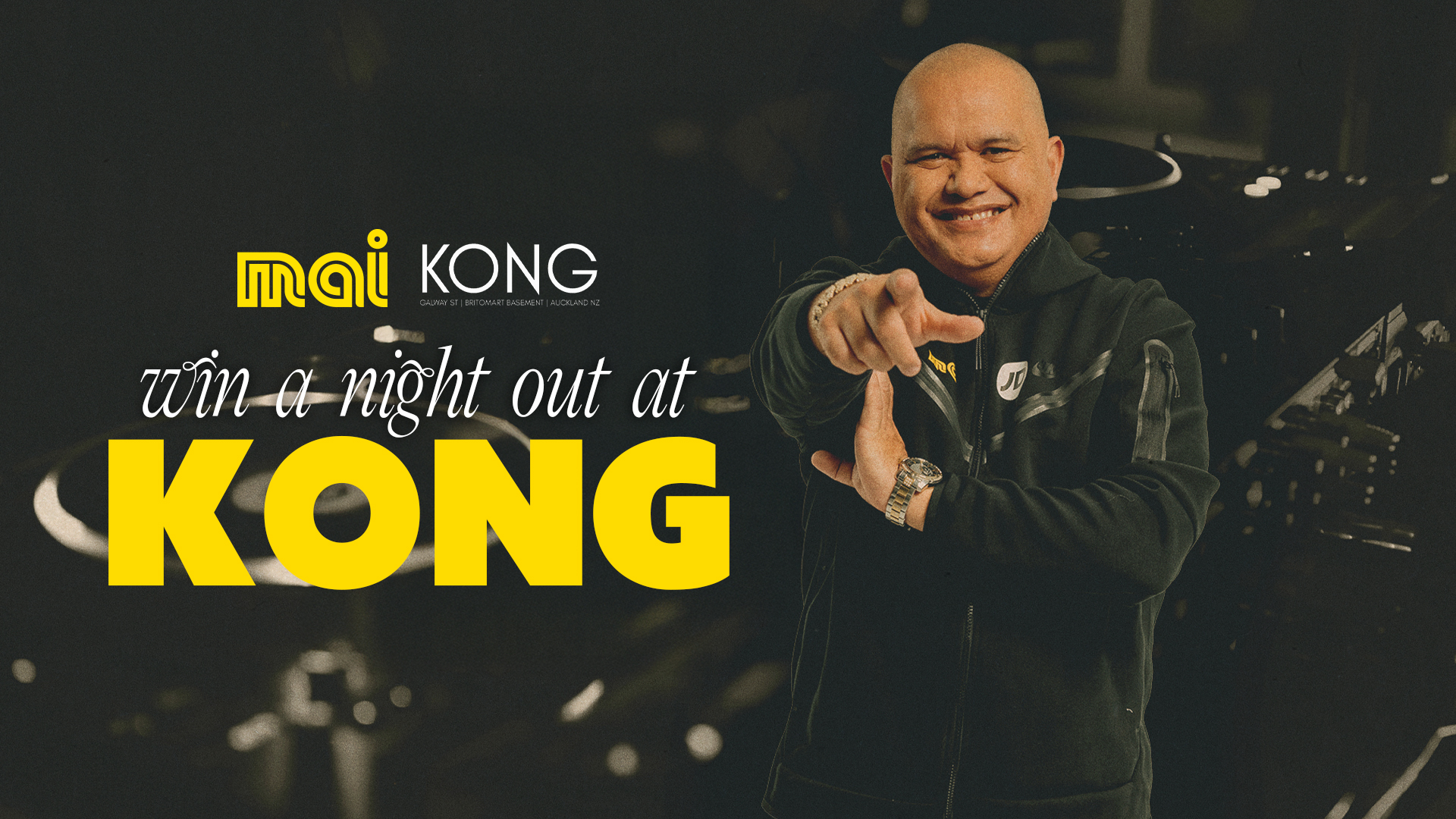 DJ decks with DJ Sir-Vere posing at camera. "Win a night out at Kong" with Mai FM.