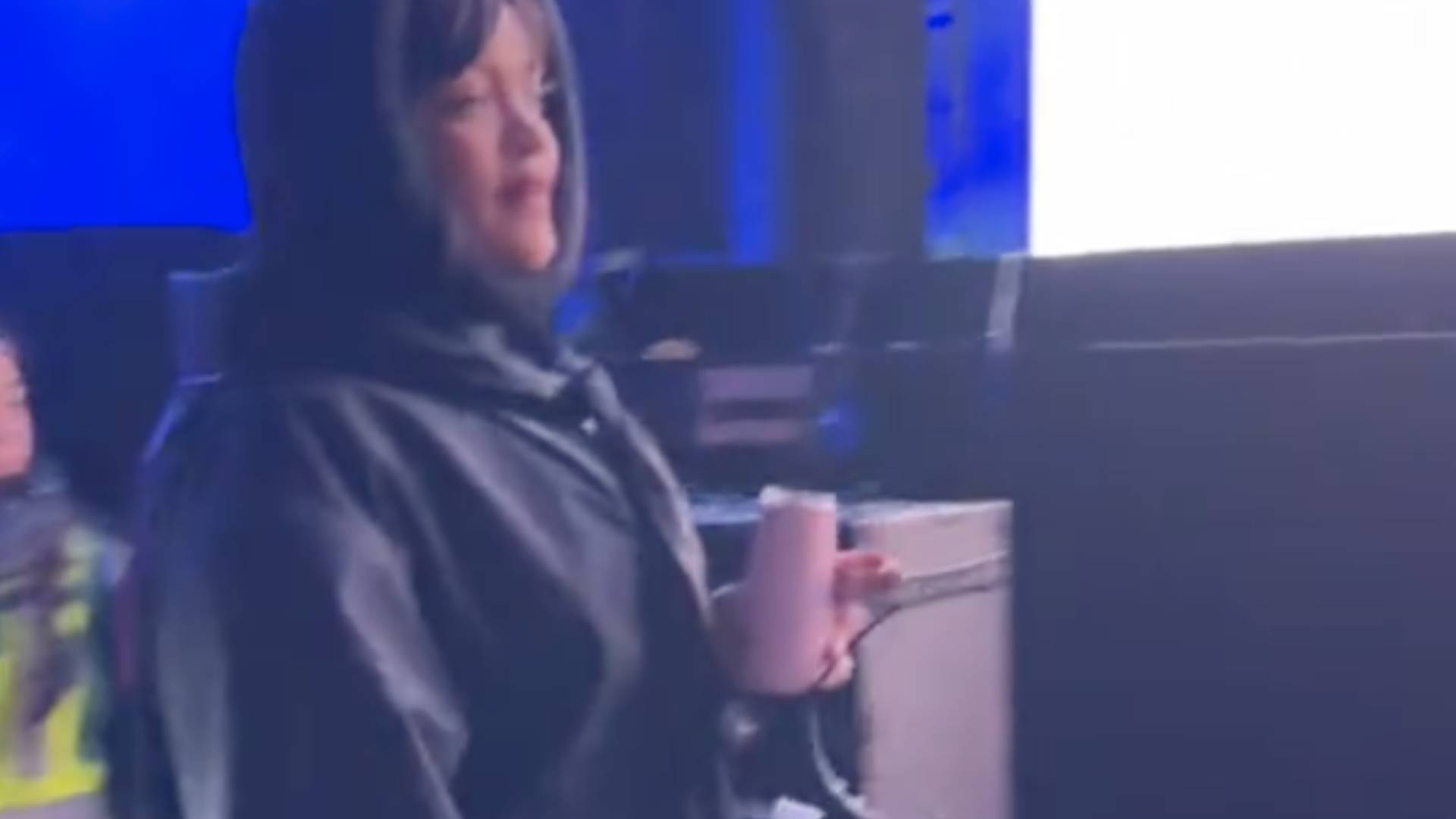 Rihanna holding a Huski champagne flute at a festival 
