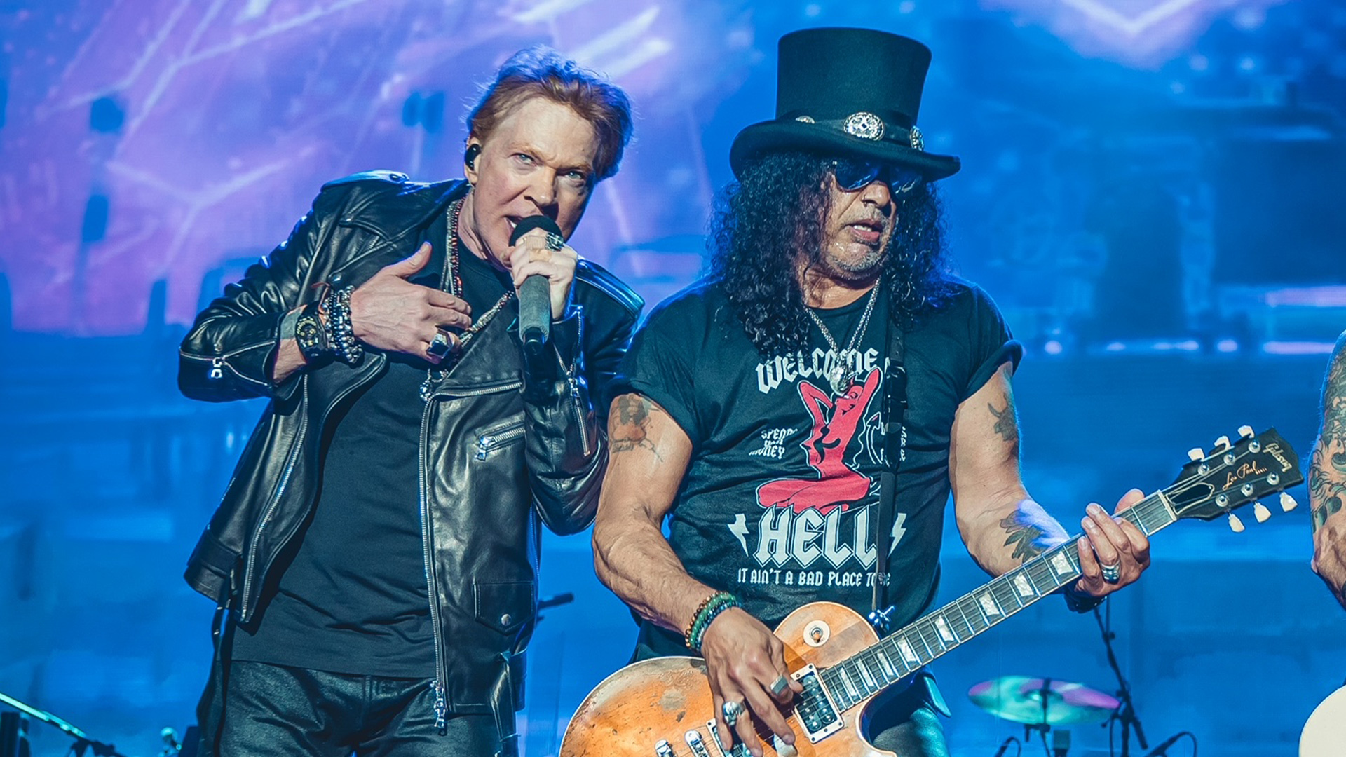 Axl Rose and Slash of Guns N' Roses performing live on stage.