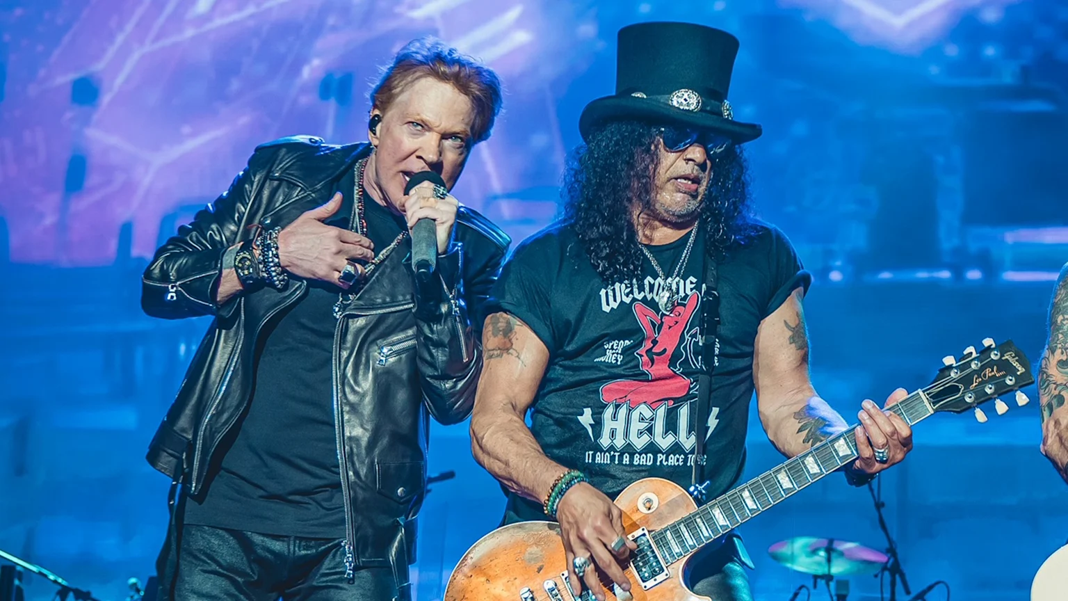 Axl Rose and Slash of Guns N' Roses performing live on stage.