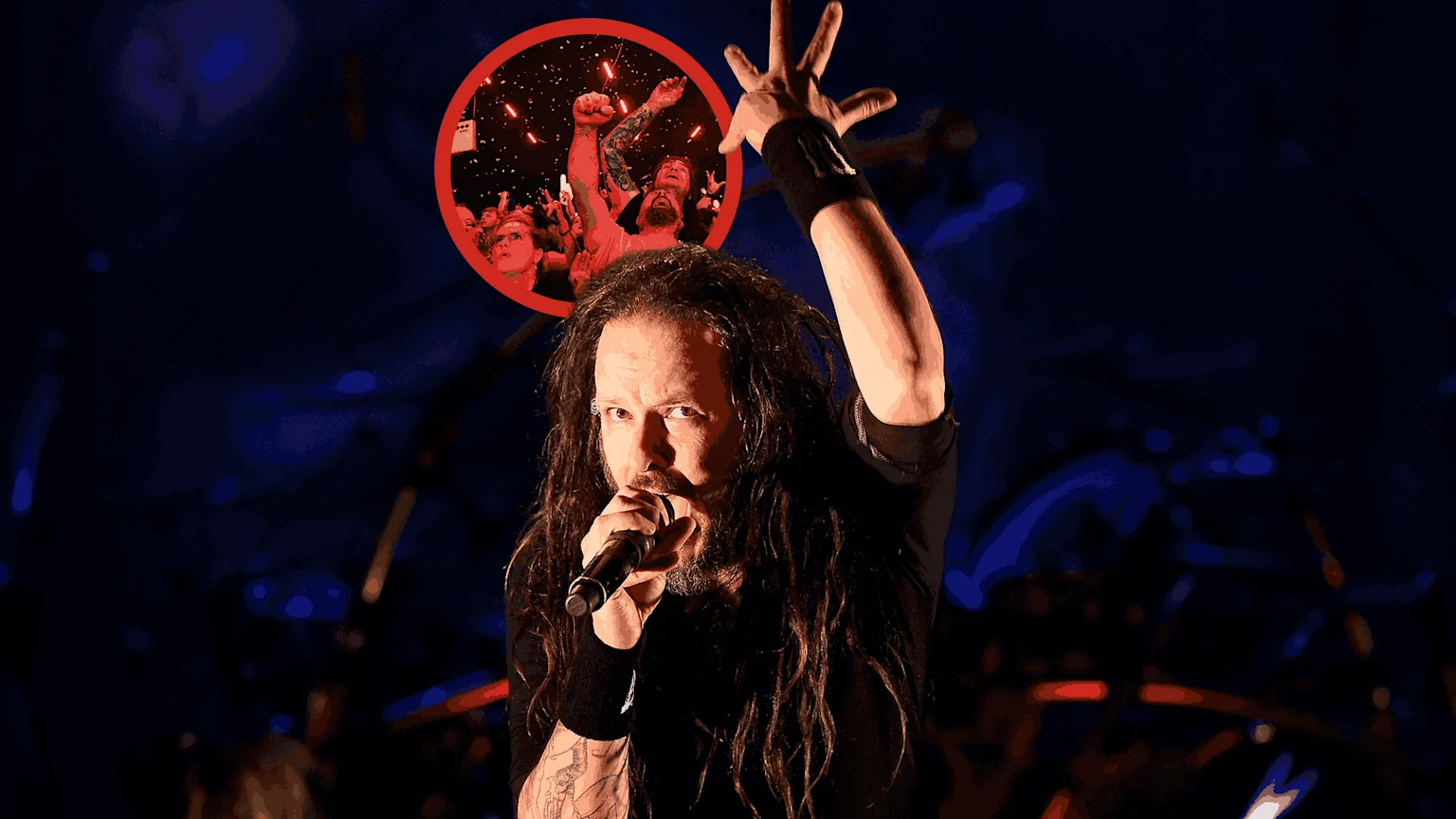 Korn frontman Jonathan Davis sings on stage with a raised arm, as a red circular inset shows a cheering concert crowd.