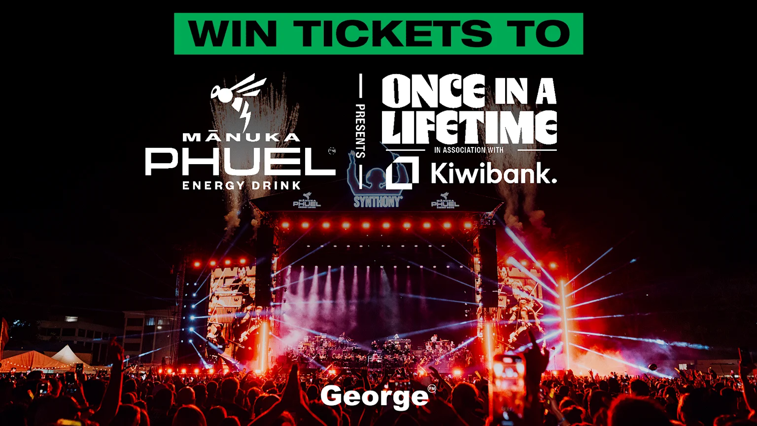 A vibrant night concert scene with a large stage glowing with red lights, a massive crowd, and promotional text "WIN TICKETS TO MĀNUKA PHUEL ONCE IN A LIFETIME" with Kiwibank, Synthony, and George logos.