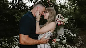 Taylor Swift and Travis Kelce looking into eachothers eyes in garden after proposal