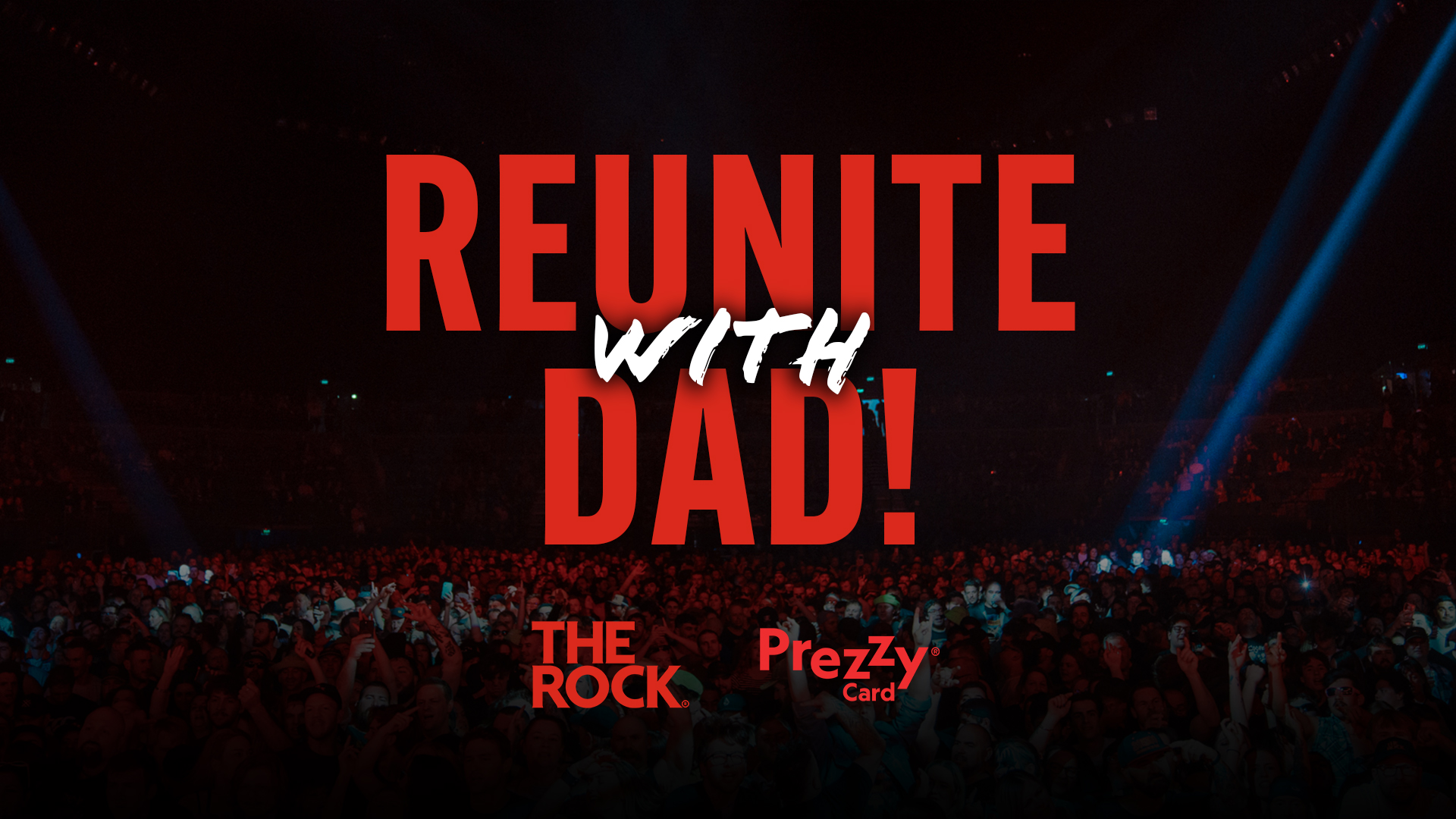 A dark concert scene with a large crowd and spotlights, featuring the prominent red text "REUNITE WITH DAD!" and "THE ROCK." and "Prezzy Card" logos at the bottom.
