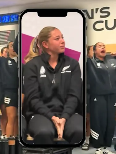 Black Fern player Amy Du Plessis sitting in the changing rooms looking upset watching teammates haka.