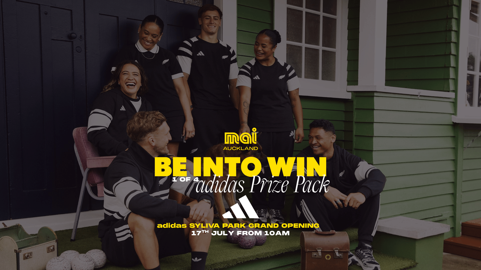 Six diverse, smiling people in black and white adidas sportswear and a dog, gathered near a house, with prominent text about winning an adidas Prize Pack and the Sylvia Park Grand Opening.