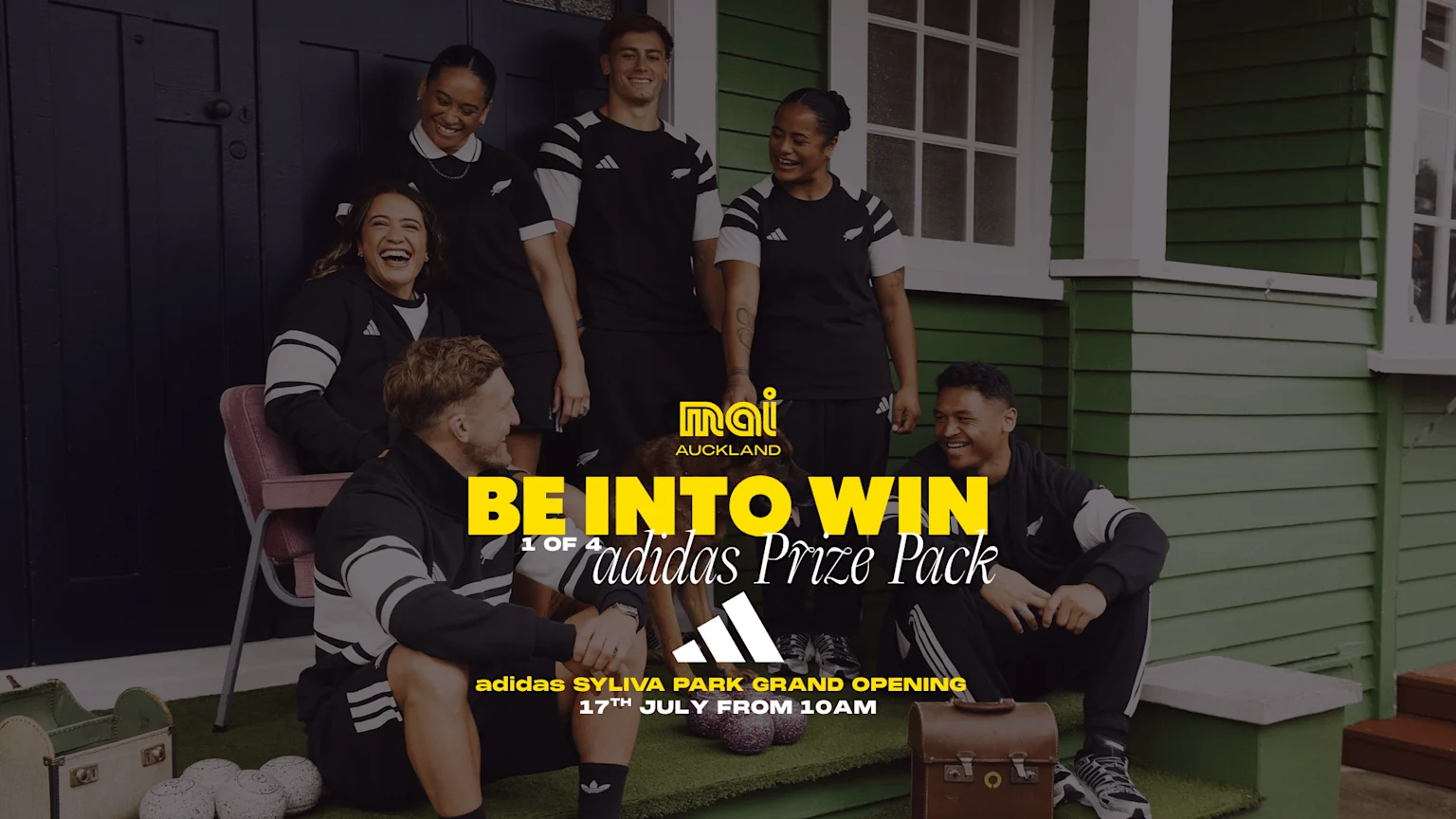 Six diverse, smiling people in black and white adidas sportswear and a dog, gathered near a house, with prominent text about winning an adidas Prize Pack and the Sylvia Park Grand Opening.