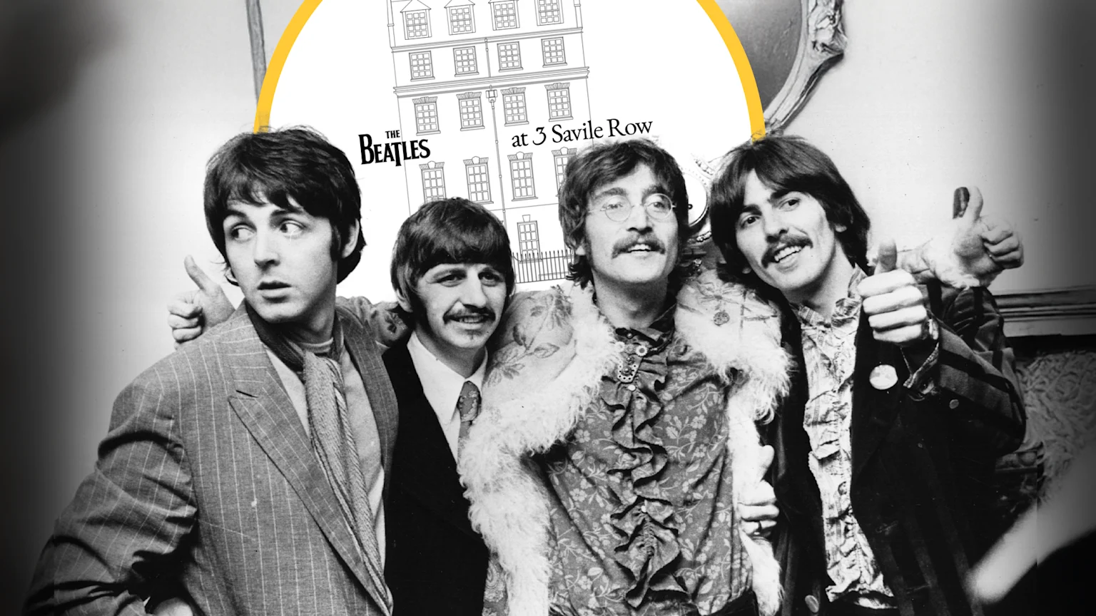 All four Beatles are smiling in a candid black and white photo of them. taken in 1967