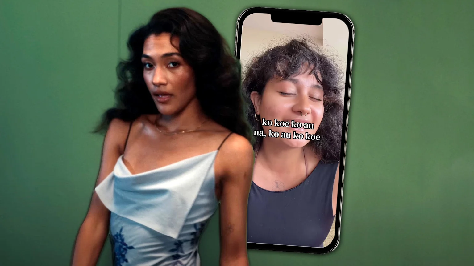 The image shows two women in a studio setting. On the left, a woman wears a light blue cowl neck camisole dress with dark floral patterns and a gold necklace, posing neutrally. To the right, a smartphone displays a close-up video of another woman with dark curly hair, piercings, and tattoos, eyes closed in a gentle smile, overlaid with white text.