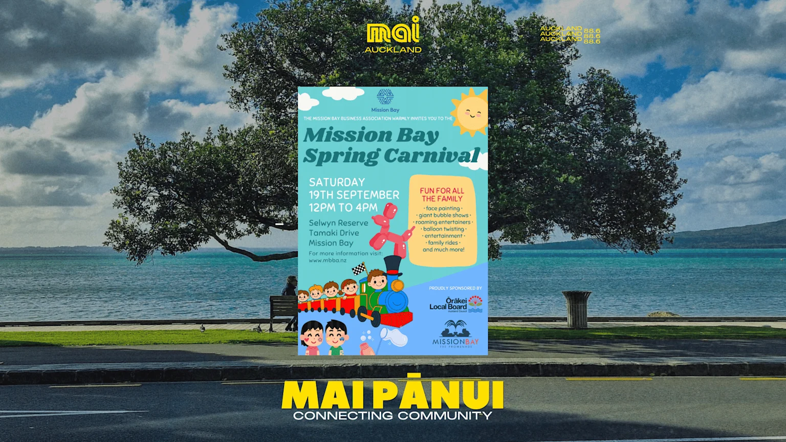 A large poster for the Mission Bay Spring Carnival, detailing the date (19th September) and family activities, stands in front of a scenic waterfront with green trees, blue sea, and a distant island.
