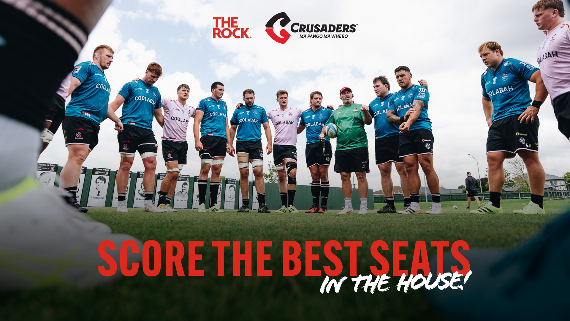 Crusaders rugby team huddle on the field. "Score the best seats in the house!" with the Crusaders and The Rock Canterbury