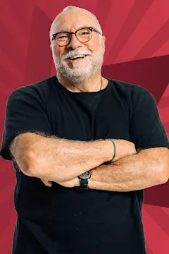 Bob Gentil smiling against a starry red background