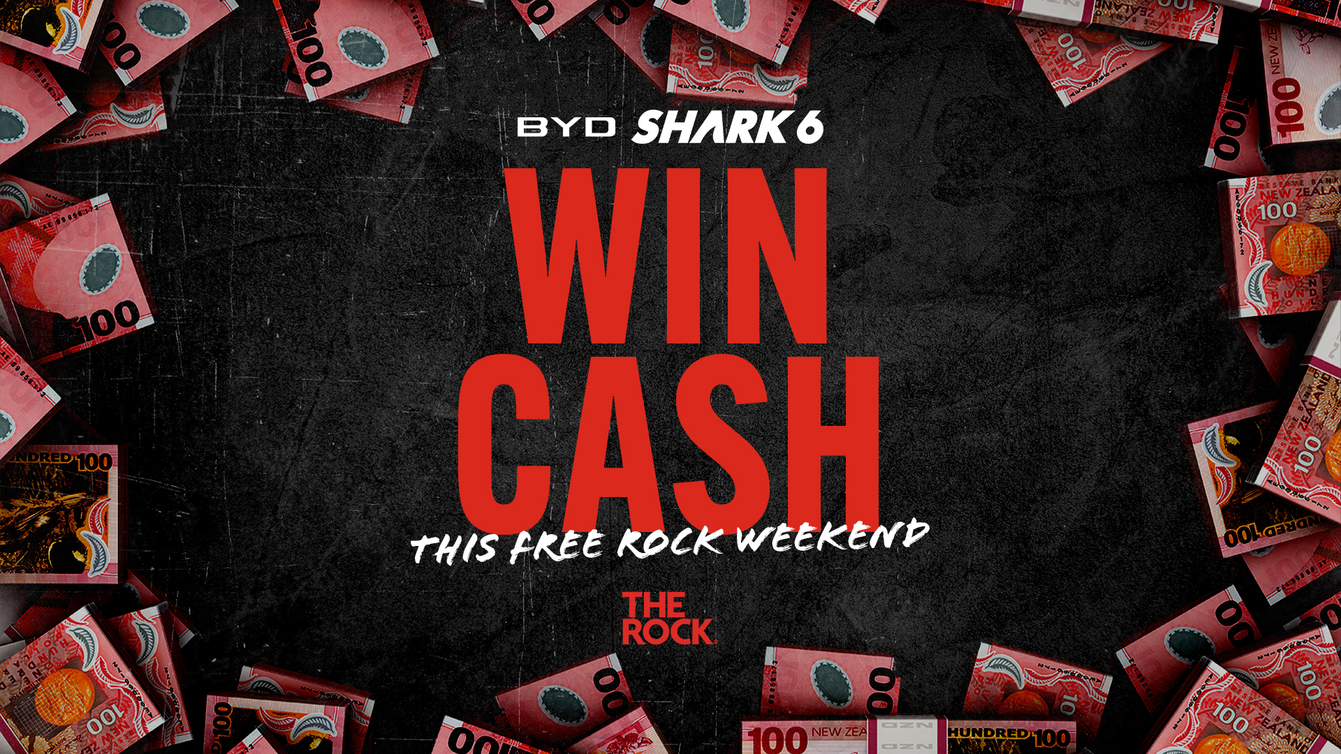 Red text "WIN CASH" is centered on a dark, textured background, framed by scattered 100 New Zealand dollar banknotes, with "BYD SHARK 6" above and "THIS FREE ROCK WEEKEND" and "THE ROCK" below.
