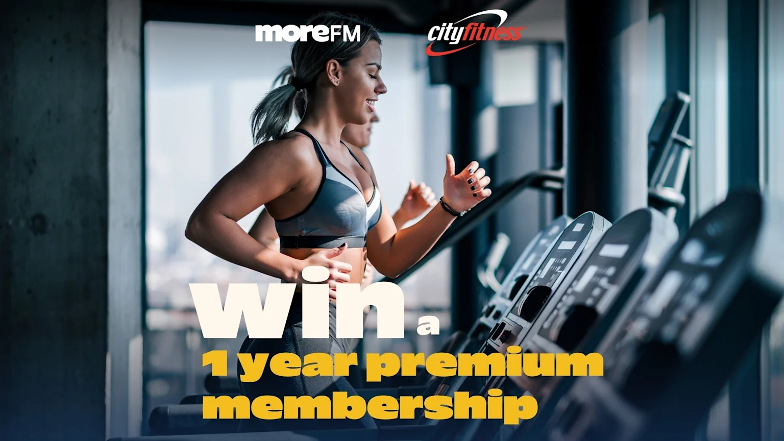 A smiling woman runs on a treadmill in a gym, with "moreFM" and "cityfitness" logos visible, and text "Win a 1 year premium membership" overlayed.