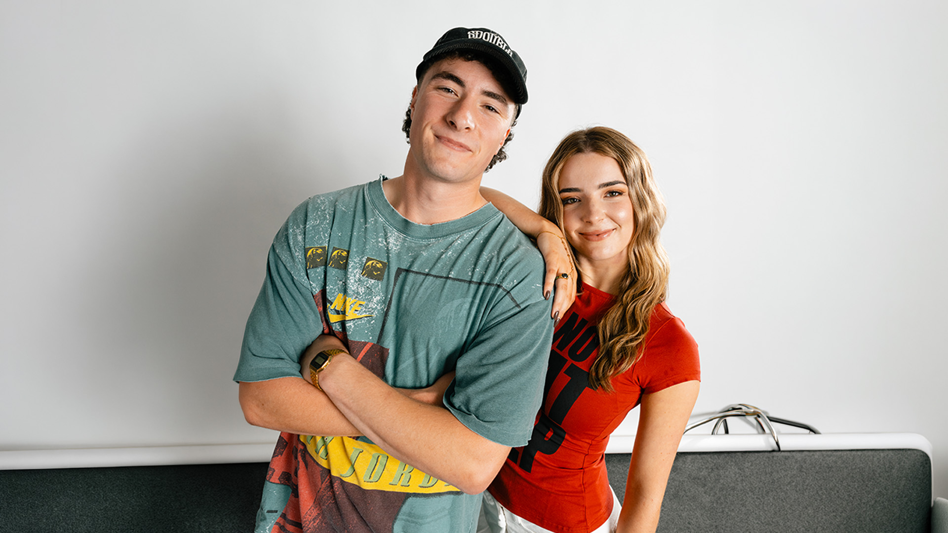 Two people smiling in casual clothing