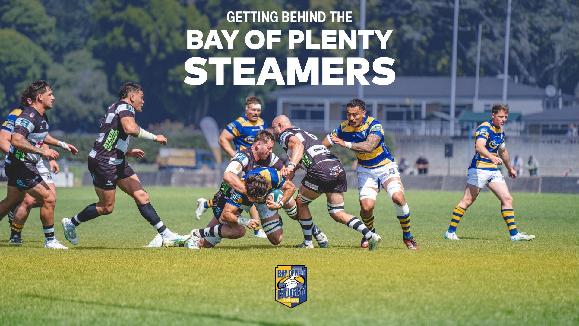A dynamic photo shows rugby players from the Bay of Plenty Steamers tackling during a match on a sunny field, with their team logo at the bottom.