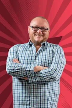 Blake Beale smiling against a starry red background