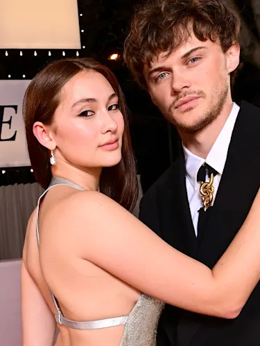 'The Summer I Turned Pretty' stars Lola Tung and Christopher Briney at a red carpet premiere.