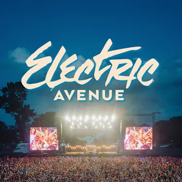 Electric Avenue festival stage bright with lights at dusk