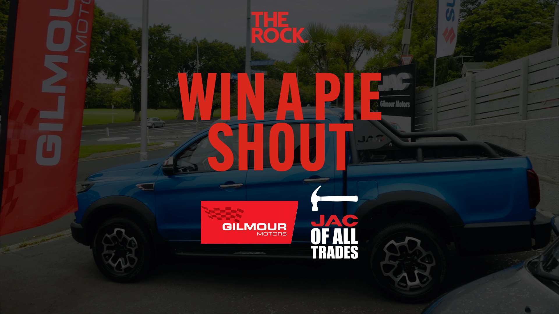 An advertisement featuring a blue JAC pickup truck with large red text "WIN A PIE SHOUT", displaying logos for "THE ROCK", "GILMOUR MOTORS", and "JAC OF ALL TRADES".