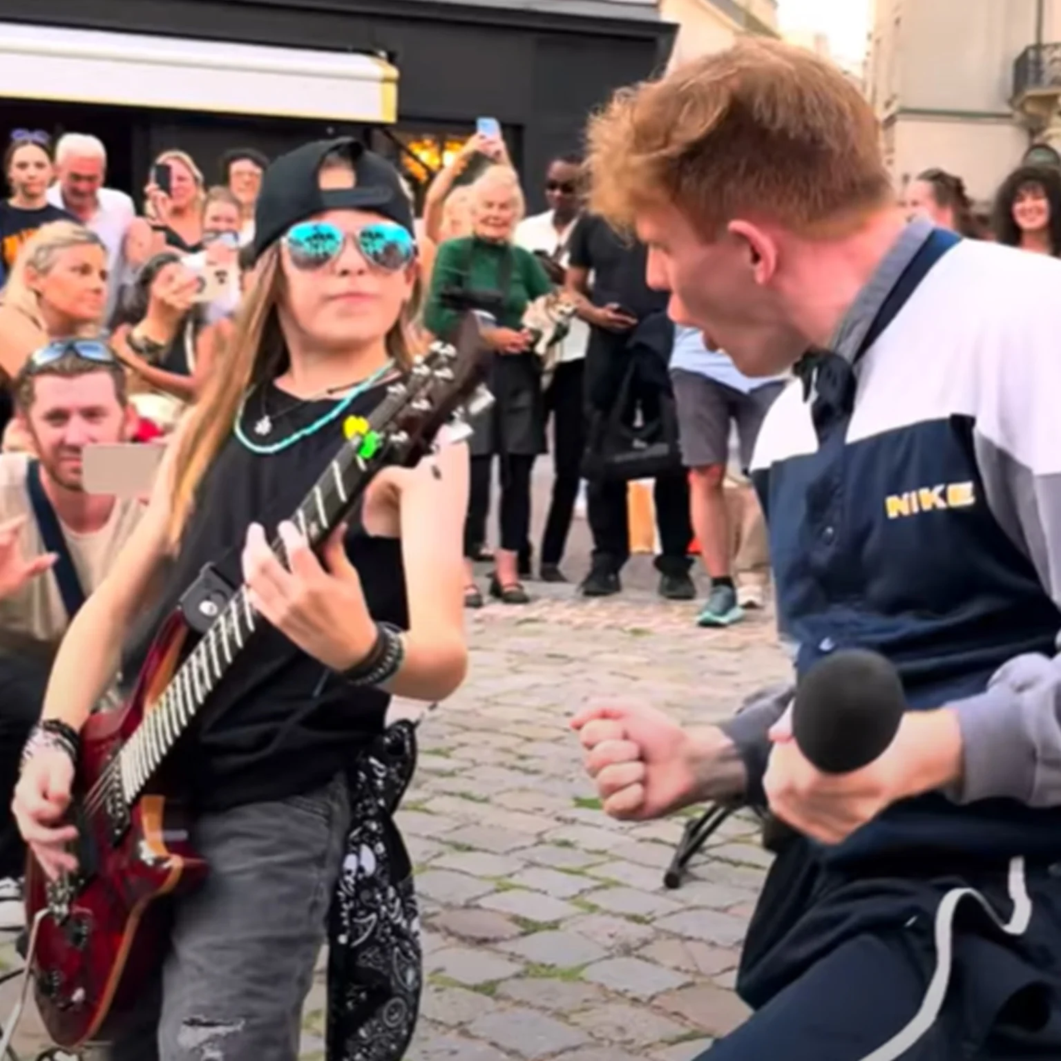 WATCH: 11yo guitarist wows in viral 'Bohemian Rhapsody' flash mob in Paris  | rova