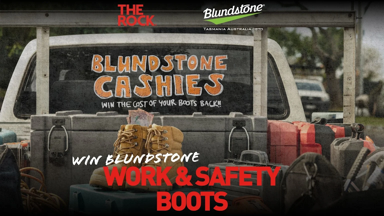 A pickup truck bed holds Blundstone work & safety boots with cash, a sign in the back window announces "BLUNDSTONE CASHIES WIN THE COST OF YOUR BOOTS BACK!!", and an overlay reads "WIN BLUNDSTONE WORK & SAFETY BOOTS".