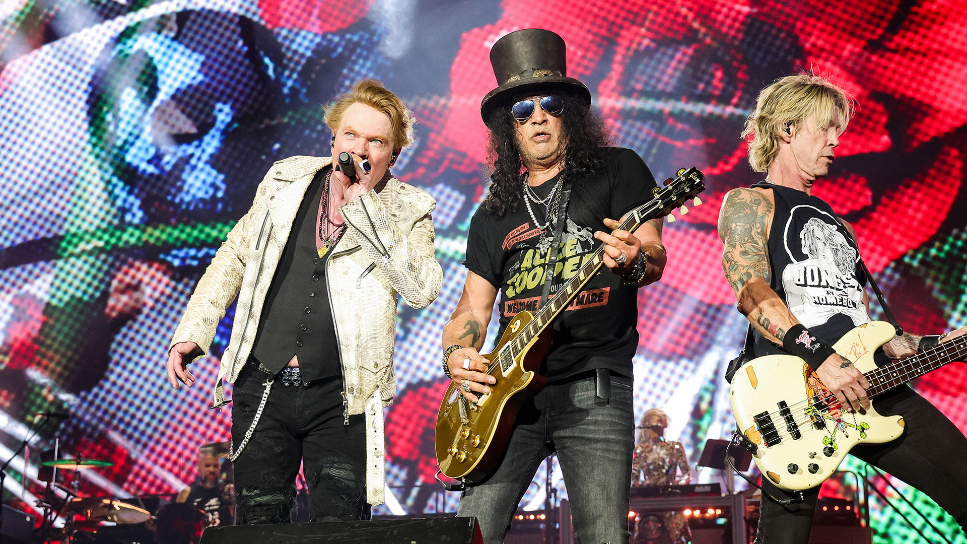 (L-R) Axl Rose, Slash, and Duff McKagan of Guns N' Roses perform onstage during the Power Trip music festival at Empire Polo Club on October 06, 2023 in Indio, California. 