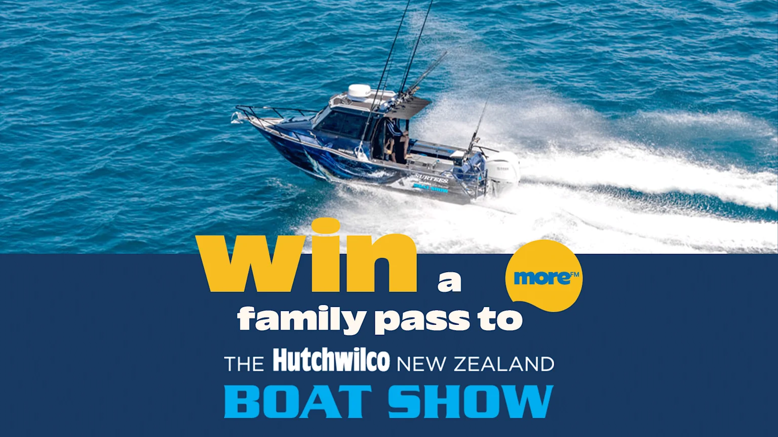A blue fishing boat with rods speeds on blue water, above a dark blue banner with "Win a family pass to THE Hutchwilco NEW ZEALAND BOAT SHOW" text and a yellow "more™" logo.