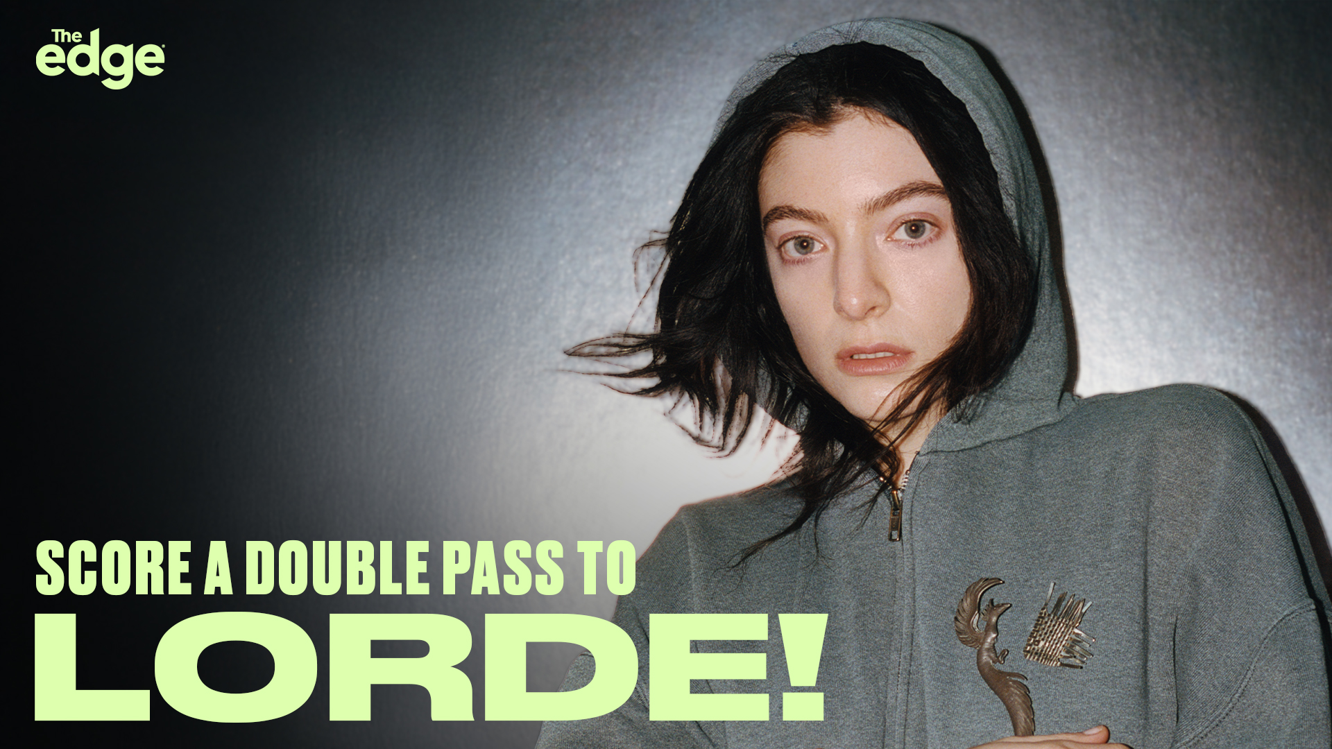 Lorde under a spotlight wearing a hoodie. "Score a double pass to Lorde!" with The Edge Auckland and Christchurch