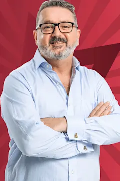 Mark Smith smiling against a starry red background