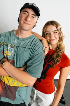 Two smiling people in casual clothing