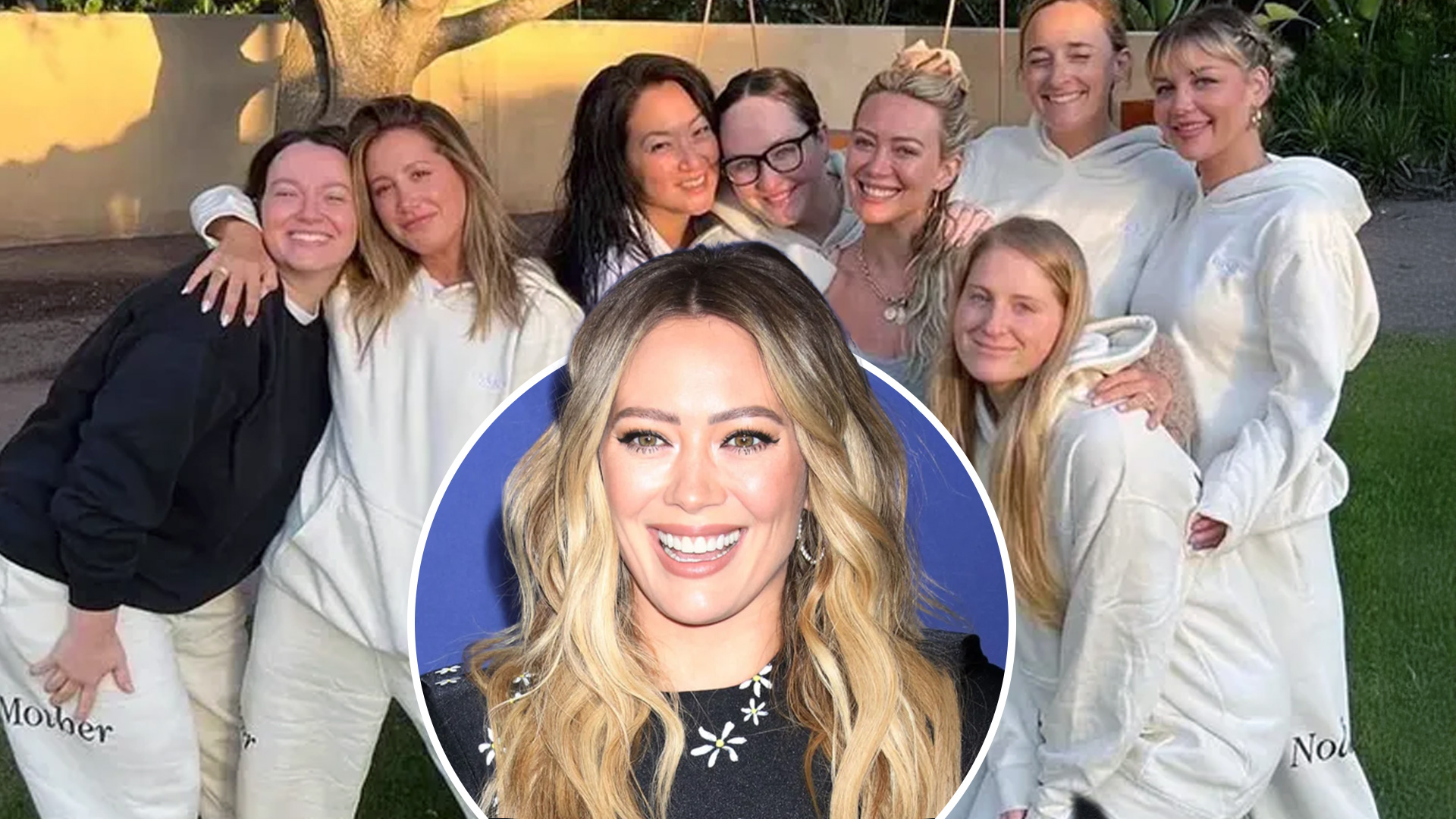 Hilary Duff, with long blonde wavy hair, smiles broadly at the camera while wearing a black top with white daisy patterns, against a blue background featuring the Disney logo.