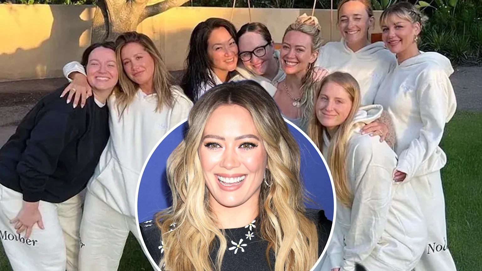 Hilary Duff, with long blonde wavy hair, smiles broadly at the camera while wearing a black top with white daisy patterns, against a blue background featuring the Disney logo.