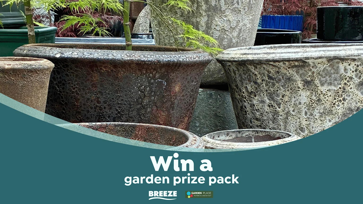 A collection of various textured ceramic plant pots in different earthy tones, some containing green plants, with a teal overlay at the bottom promoting a "garden prize pack."