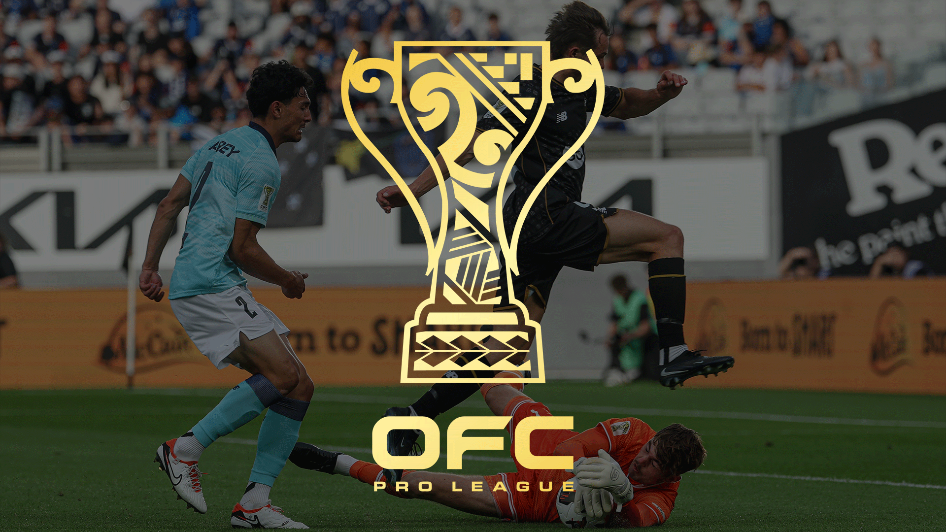 Three soccer players in action on a field—one in light blue, one in dark uniform kicking, and an orange-clad goalkeeper diving—with spectators and ads in the background, overlaid by a gold trophy logo and 'OFC PRO LEAGUE' text.