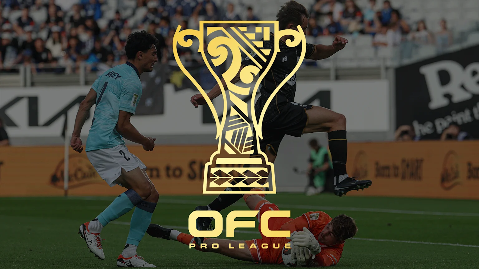 Three soccer players in action on a field—one in light blue, one in dark uniform kicking, and an orange-clad goalkeeper diving—with spectators and ads in the background, overlaid by a gold trophy logo and 'OFC PRO LEAGUE' text.