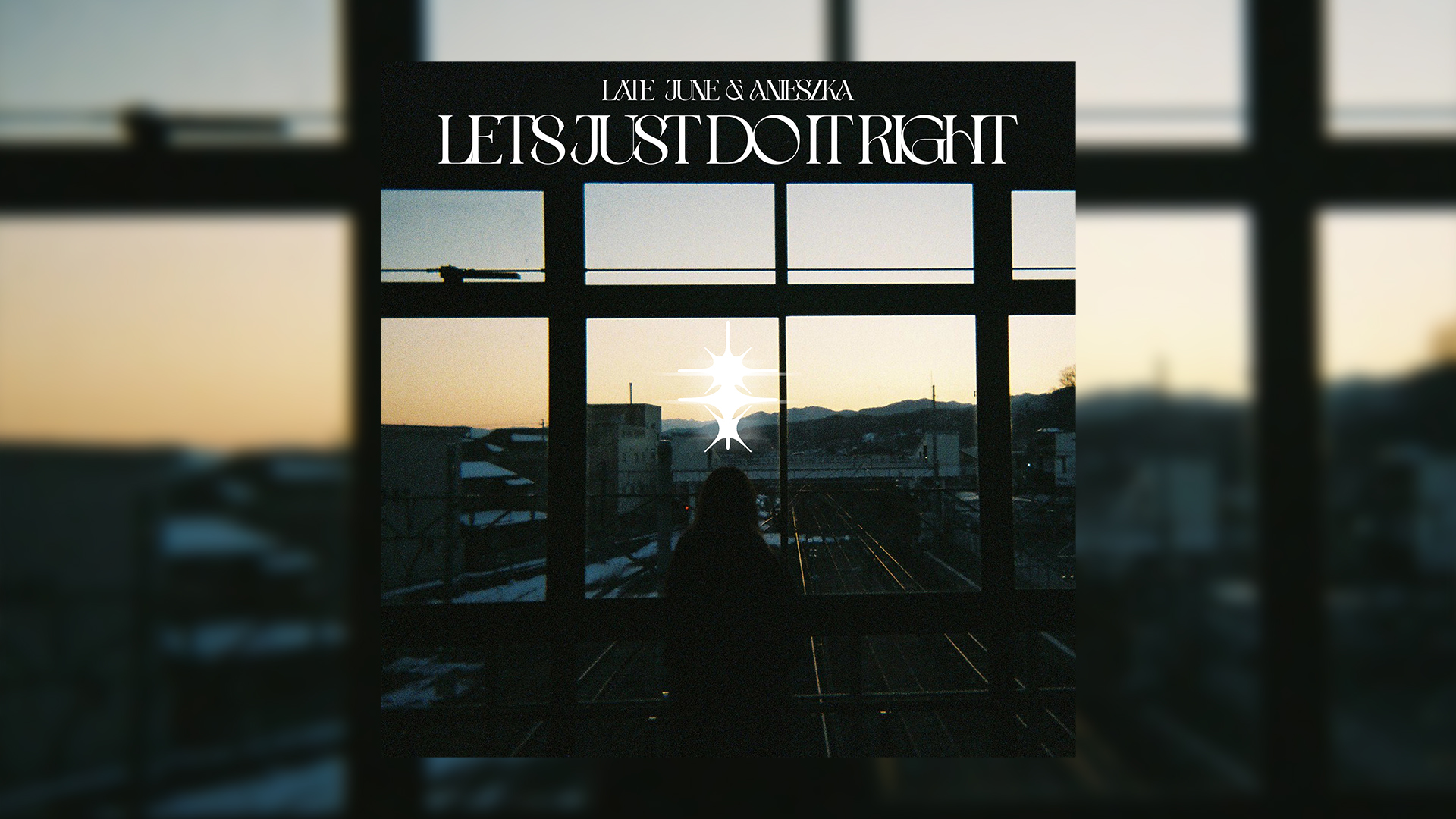 Album cover featuring a silhouetted figure gazing out a window at a sunset view with buildings, snow, and train tracks, adorned with white text "LATE JUNE & ANIESZKA LETS JUST DO IT RIGHT" and bright starburst graphics.
