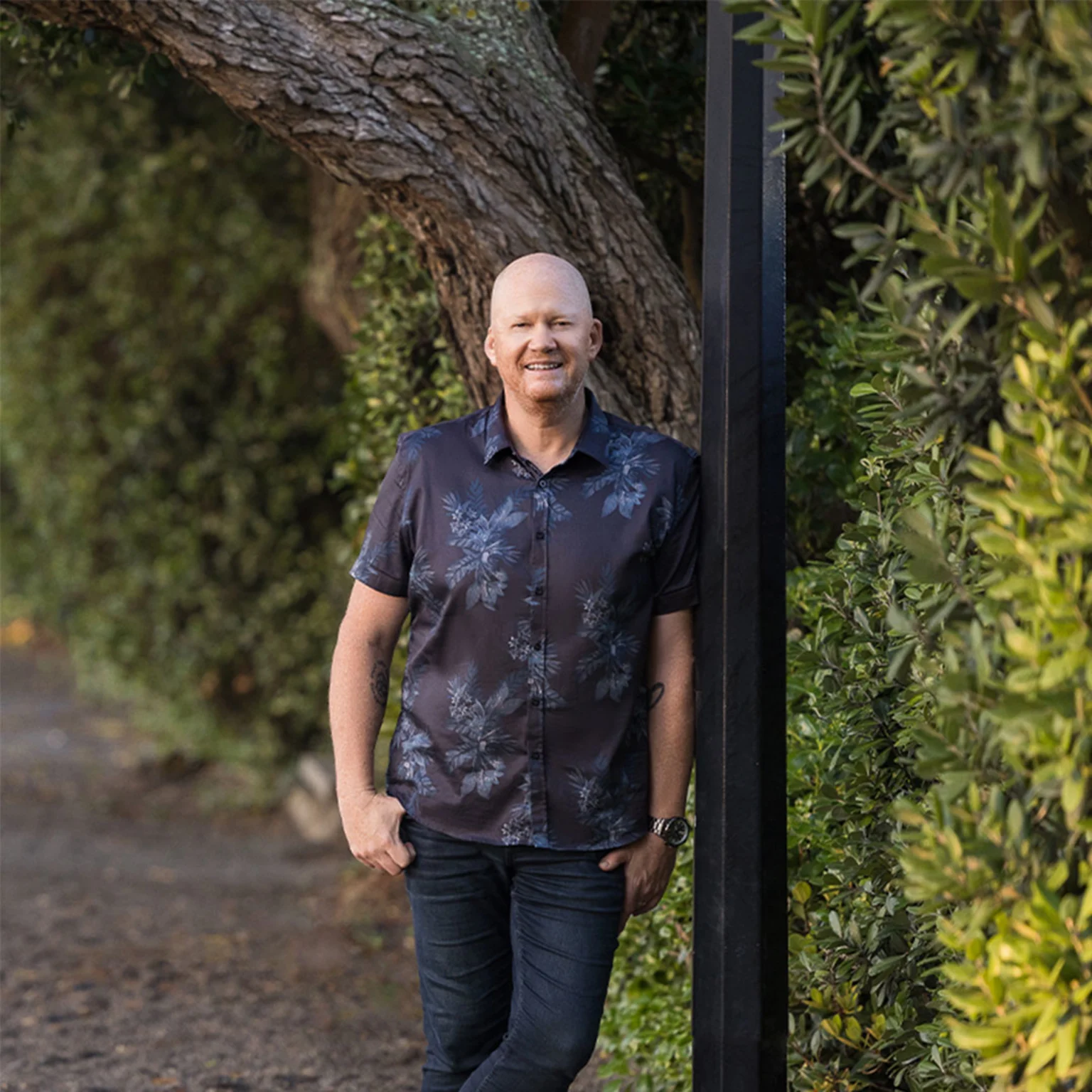 Martin Good standing on footpath next to hedge