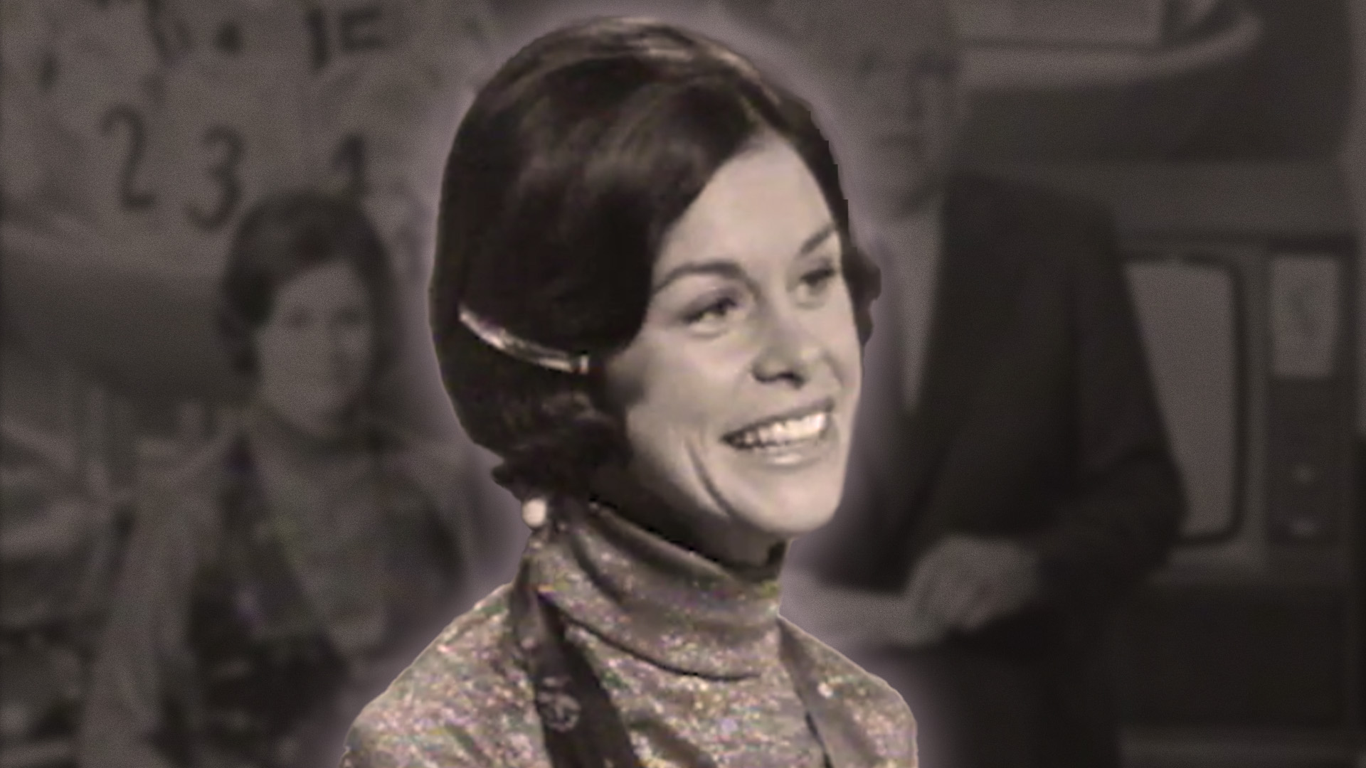 Old picture of Heather Eggleton smiling while presenting 'It's in the Bag'