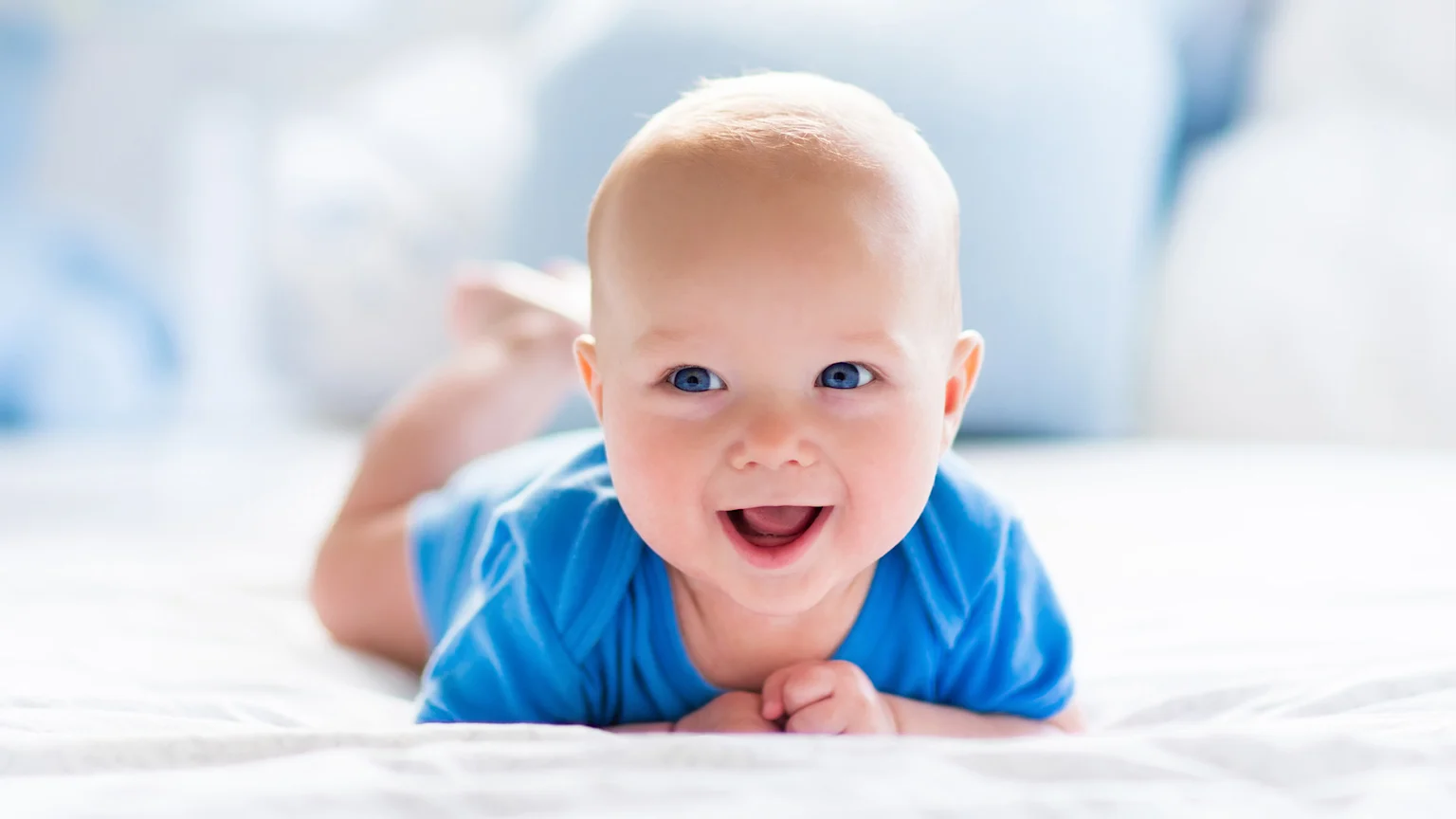 Baby smiling lying down