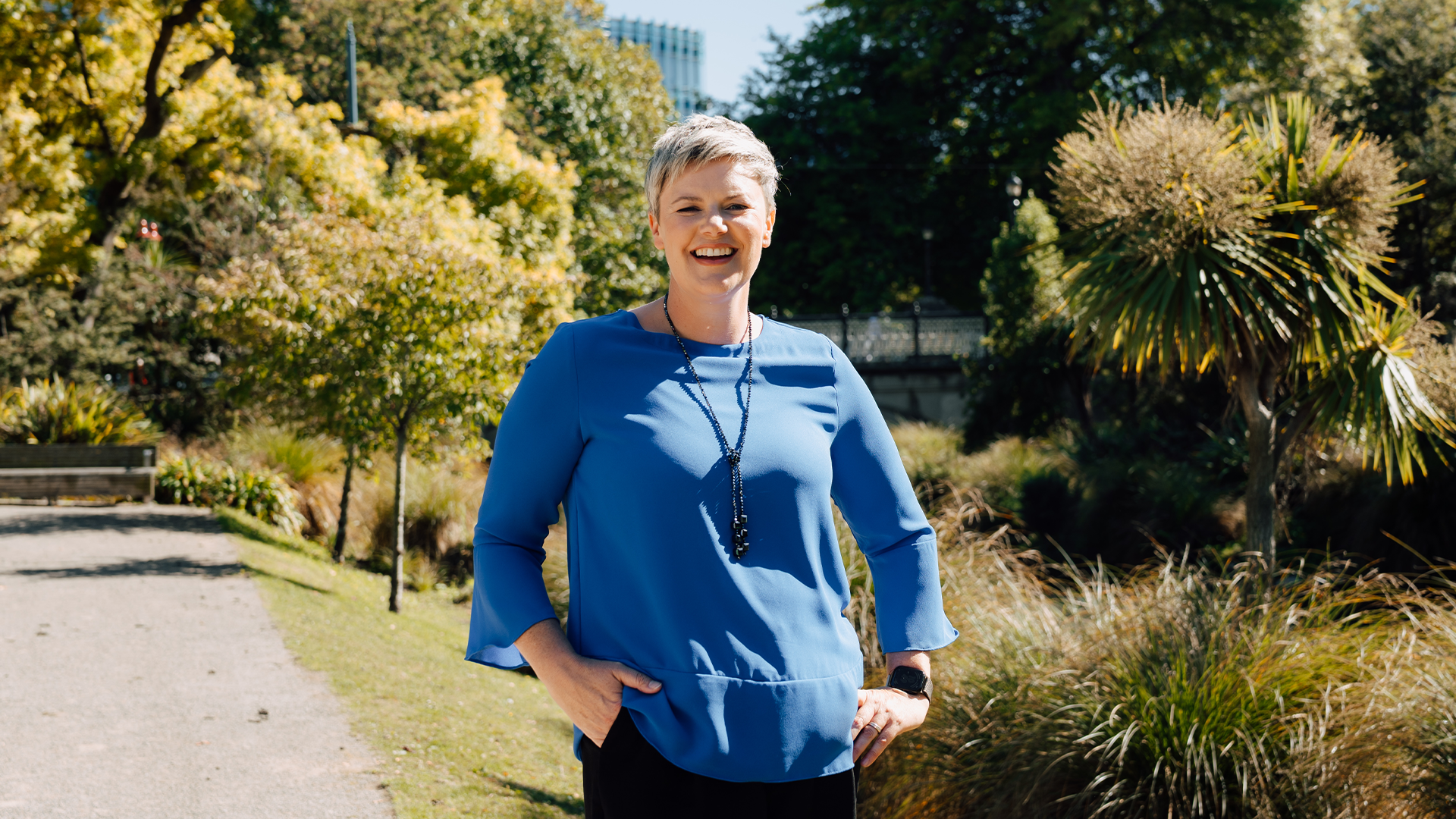 Sarah van der Kley standing with trees behind