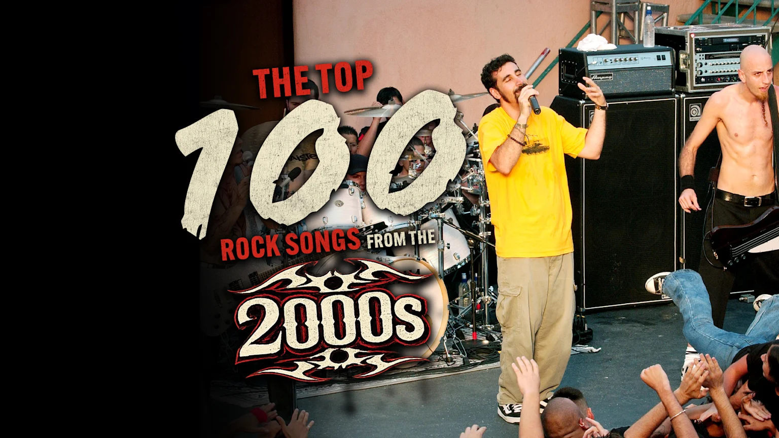 A rock band performs on stage, featuring a singer with a microphone and a shirtless bassist, with large text overlaying "THE TOP 100 ROCK SONGS FROM THE 2000S".