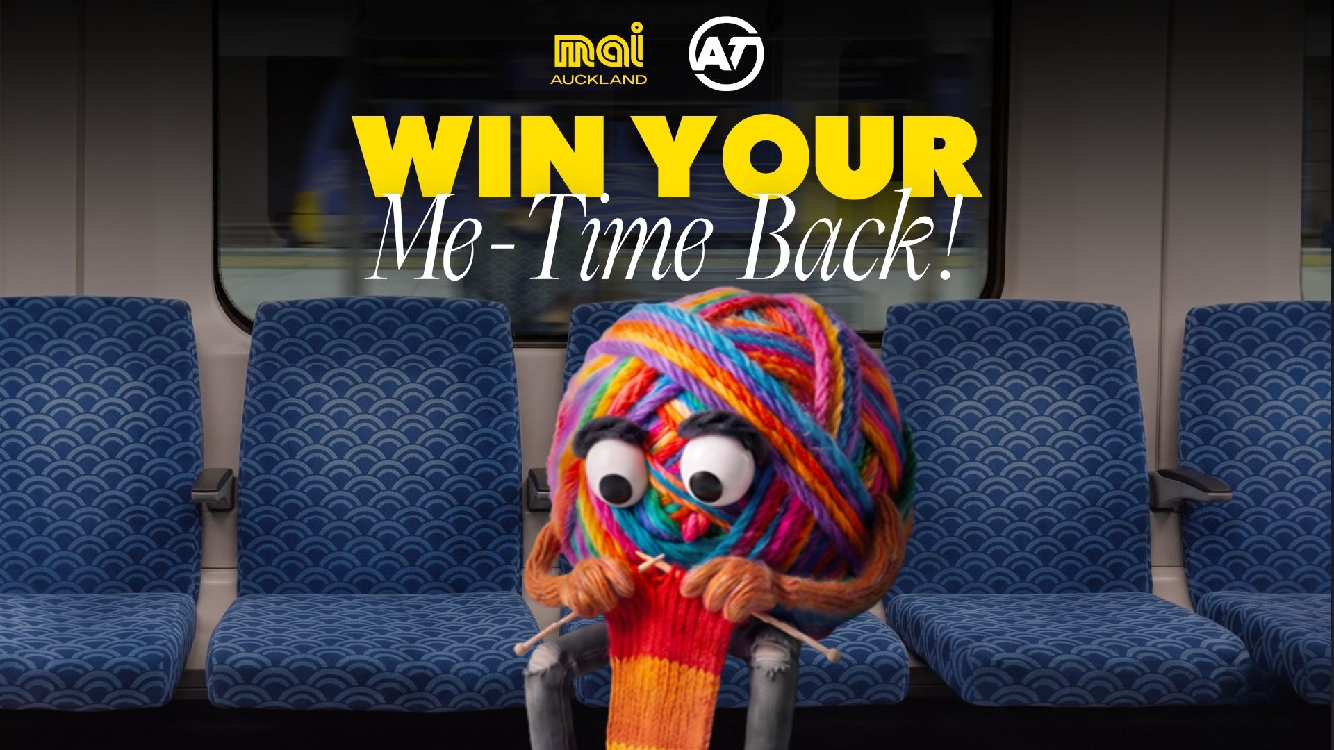A colorful yarn character with googly eyes knits on a train seat under the text "WIN YOUR Me-Time Back!", with Mai Auckland and AT logos visible.