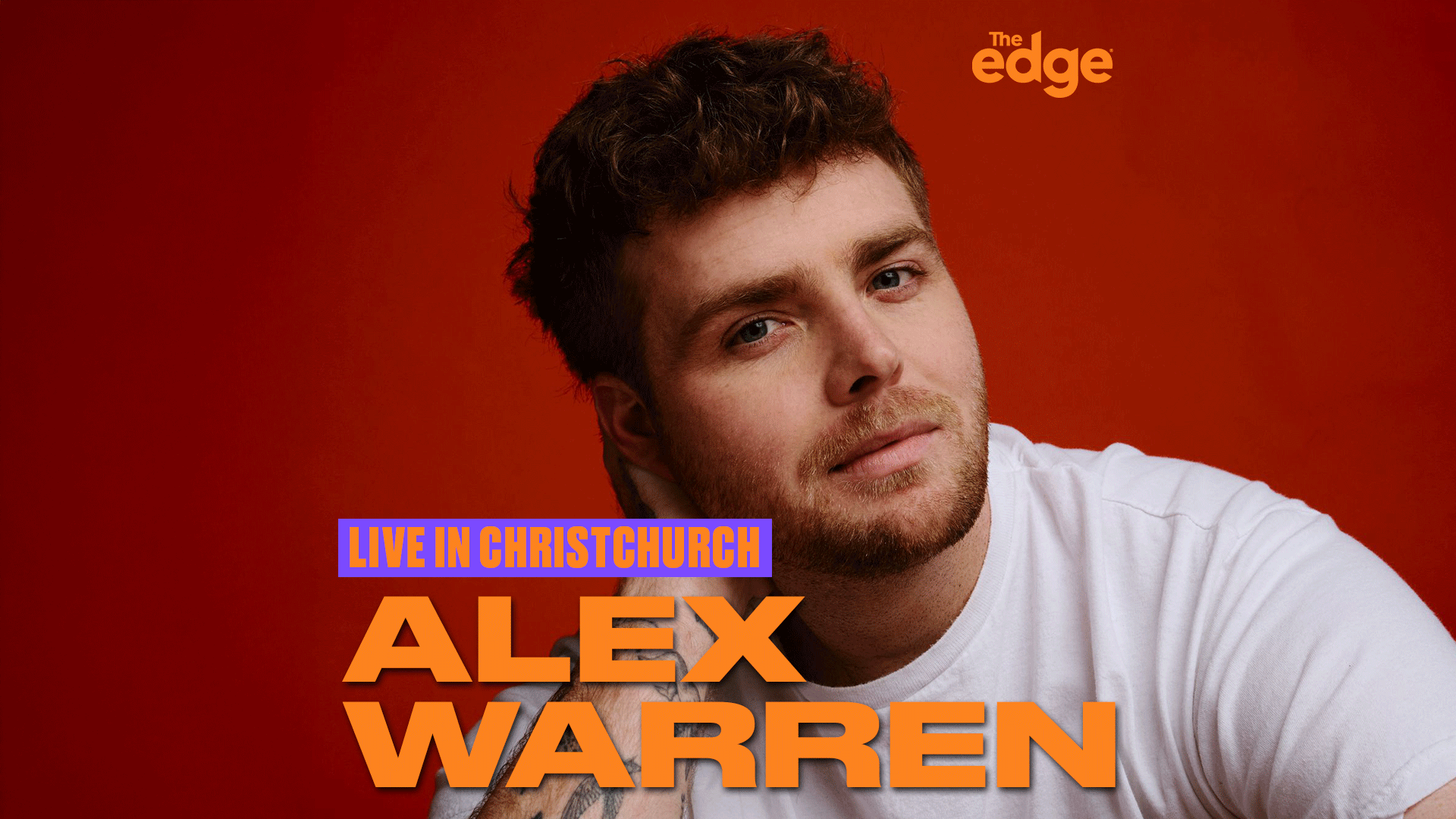 A man with brown hair and a beard in a white t-shirt looks at the viewer against a red background, with text "LIVE IN CHRISTCHURCH", "ALEX WARREN", and "The edge" visible.