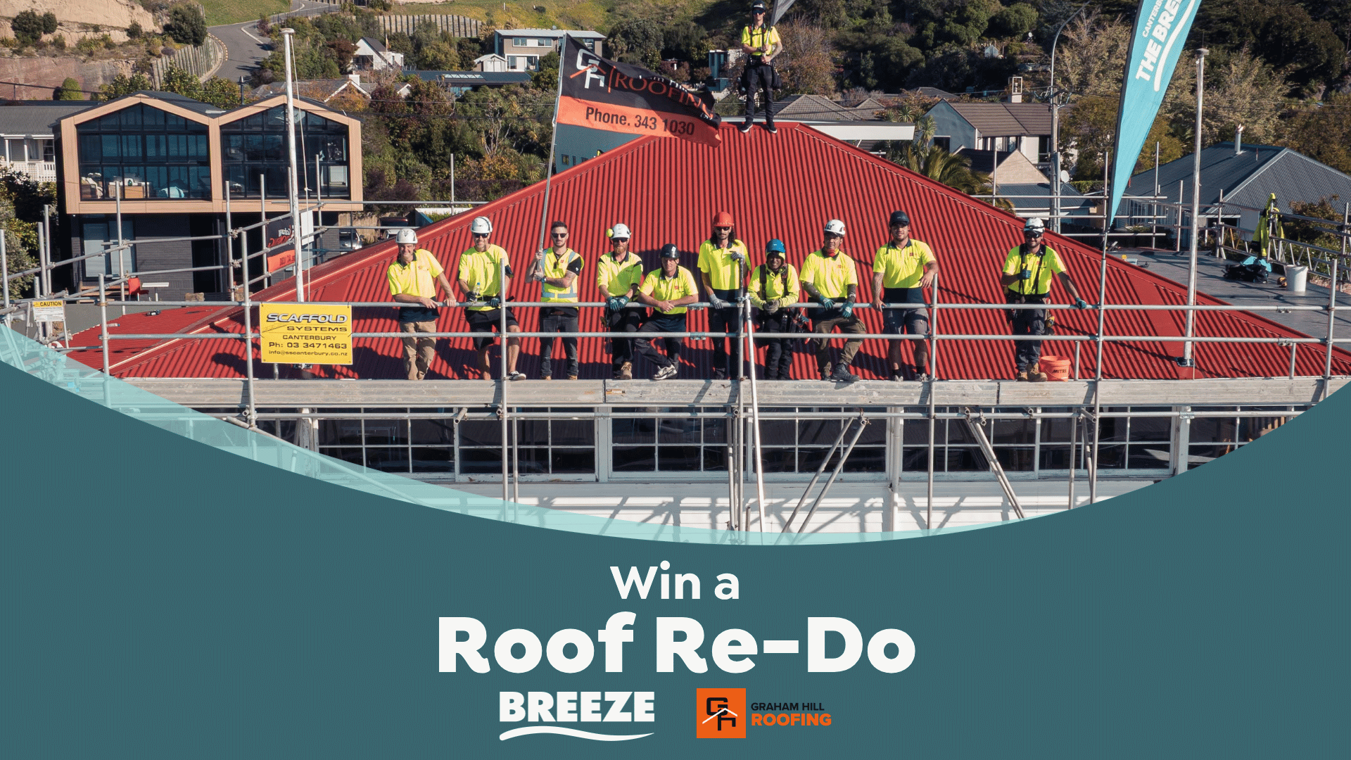 A team of roofers in yellow shirts and hard hats stand on scaffolding and a red corrugated roof, with "Graham Hill Roofing" branding and a "Win a Roof Re-Do" promotion.