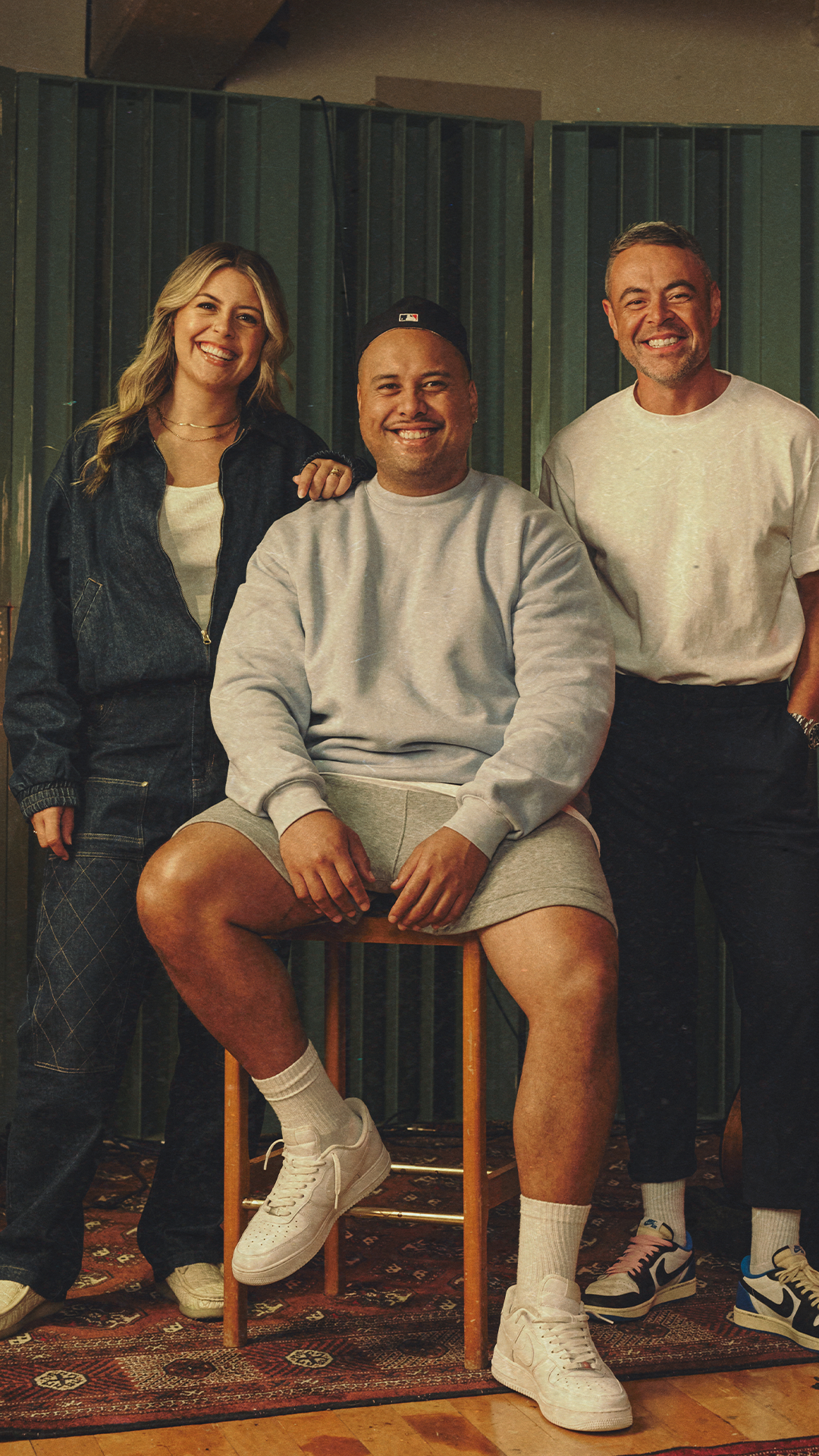 Tegan, Fame and Nickson smiling at a music studio