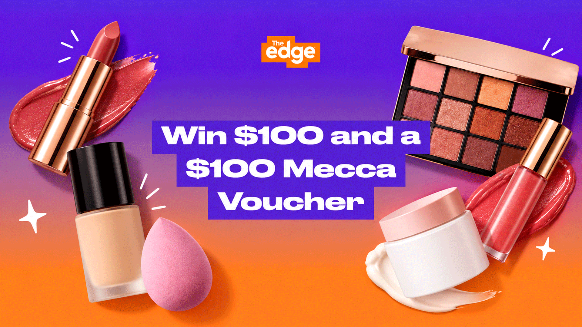 A promotional image for "The edge" showcasing a variety of makeup products including lipstick, foundation, an eyeshadow palette, lip gloss, and a cream jar, with text "Win $100 and a $100 Mecca Voucher" on a purple and orange background.