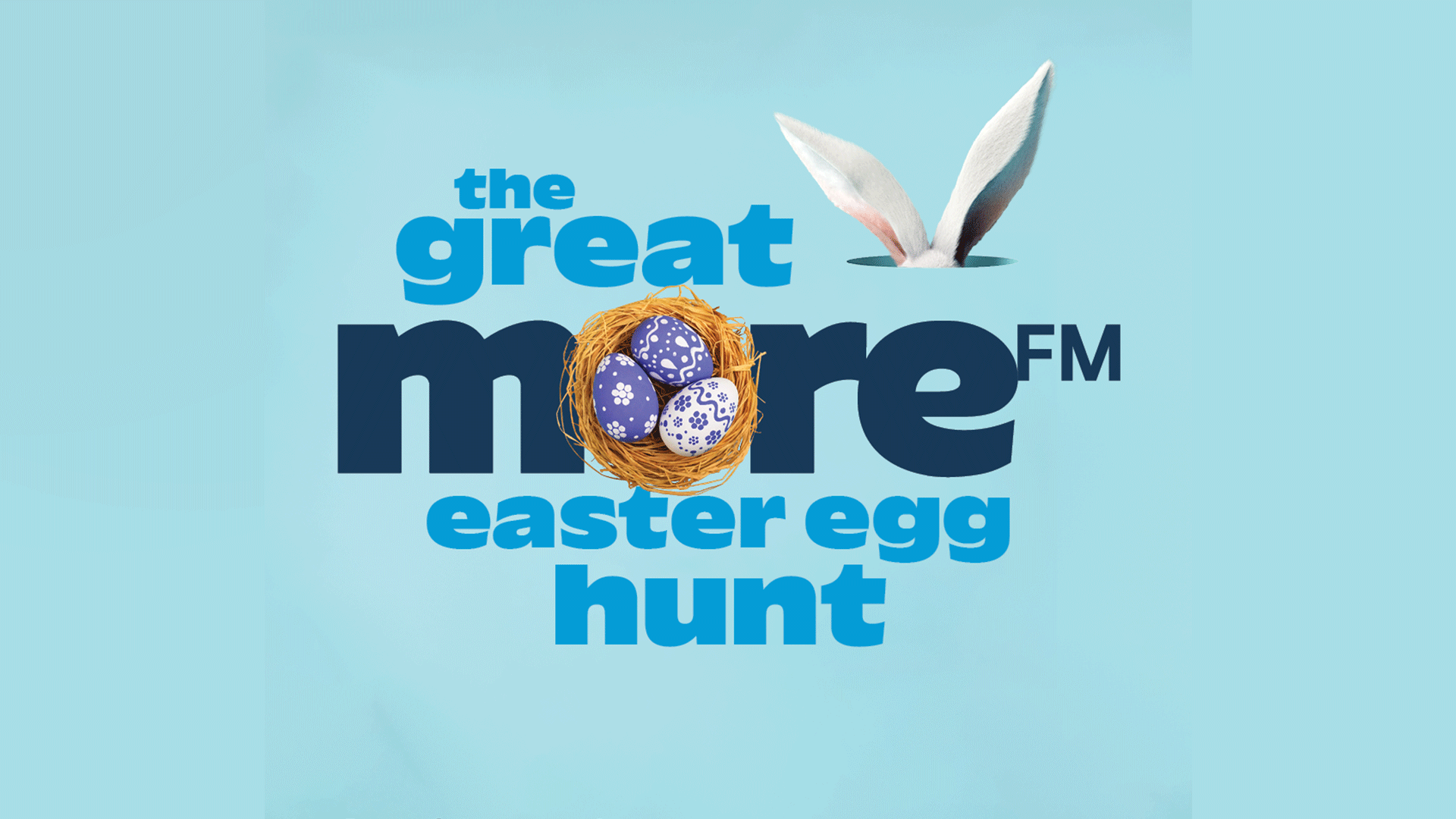 Logo for 'The Great More FM Easter Hunt' featuring blue text, a nest with three purple and white patterned eggs, and white bunny ears peeking.